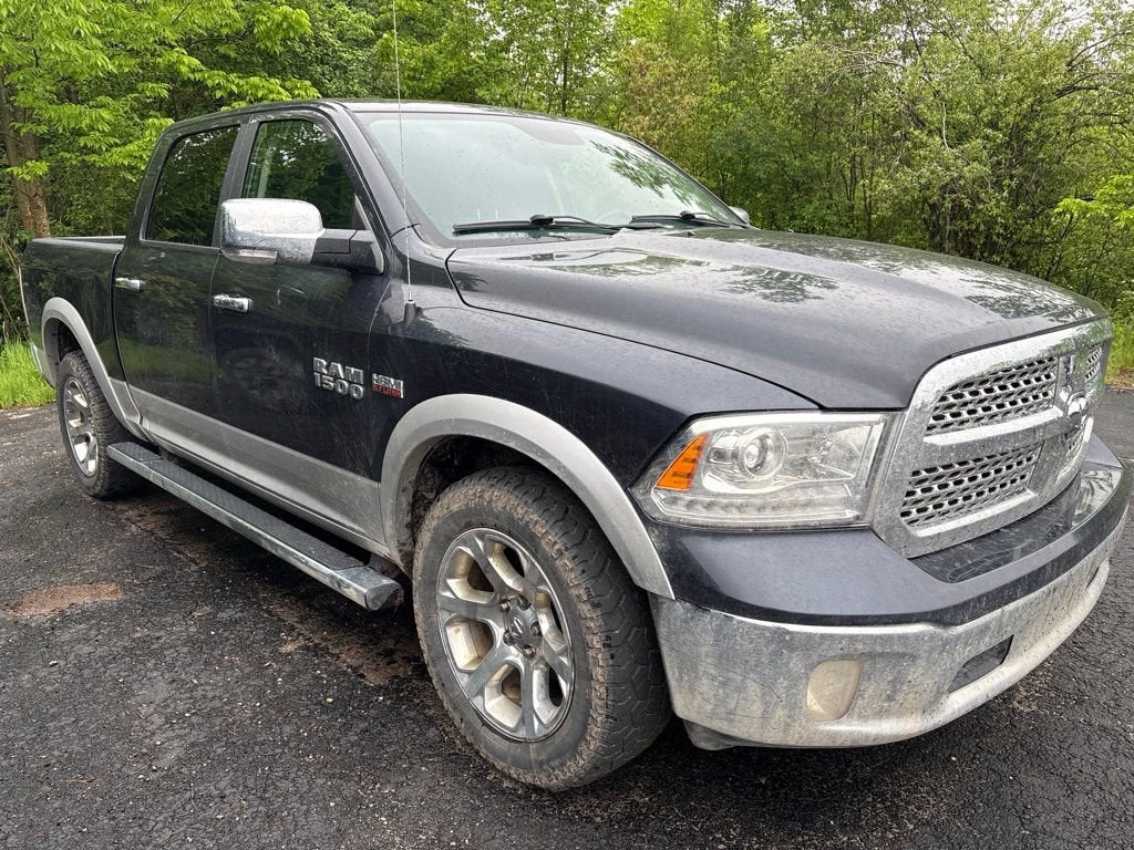 2017 RAM 1500 Laramie Crew Cab 4x4 5'7" Box in Gray — front three-quarter view