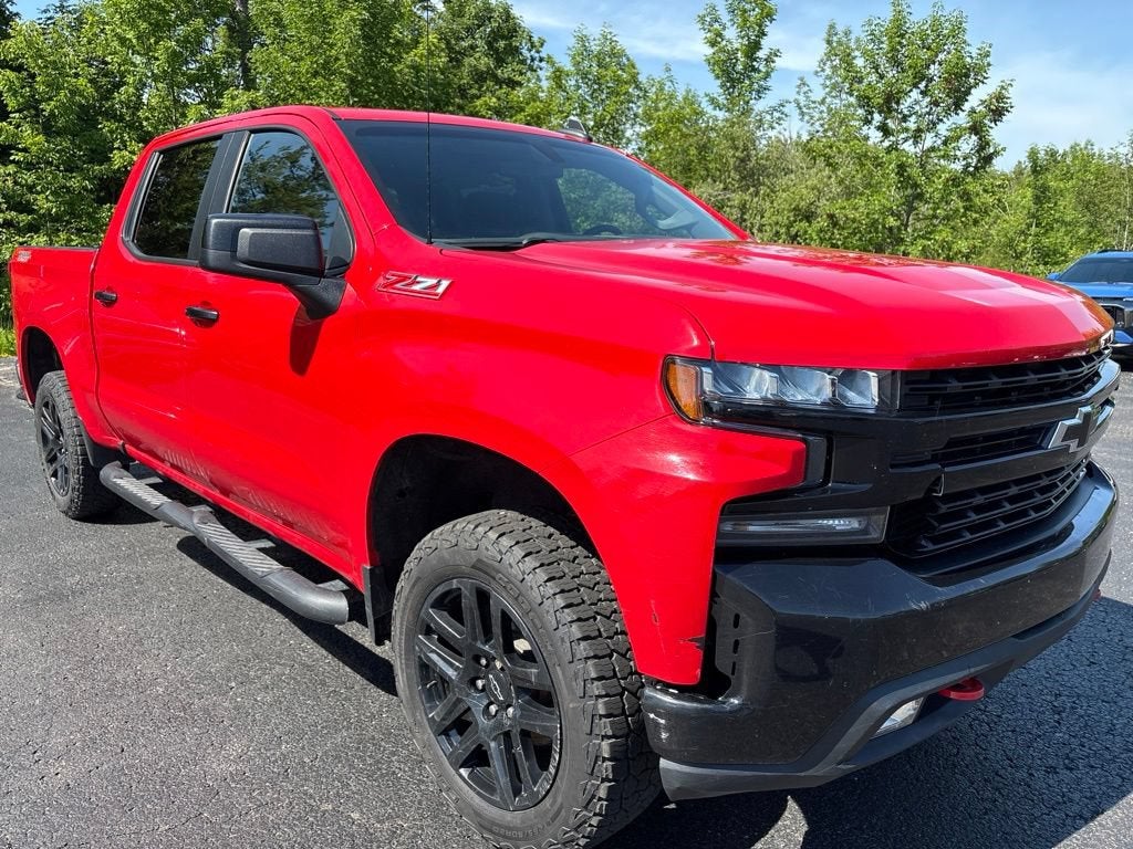 2022 Chevrolet Silverado 1500 LTD LT Trail Boss in Red Hot — front three-quarter view